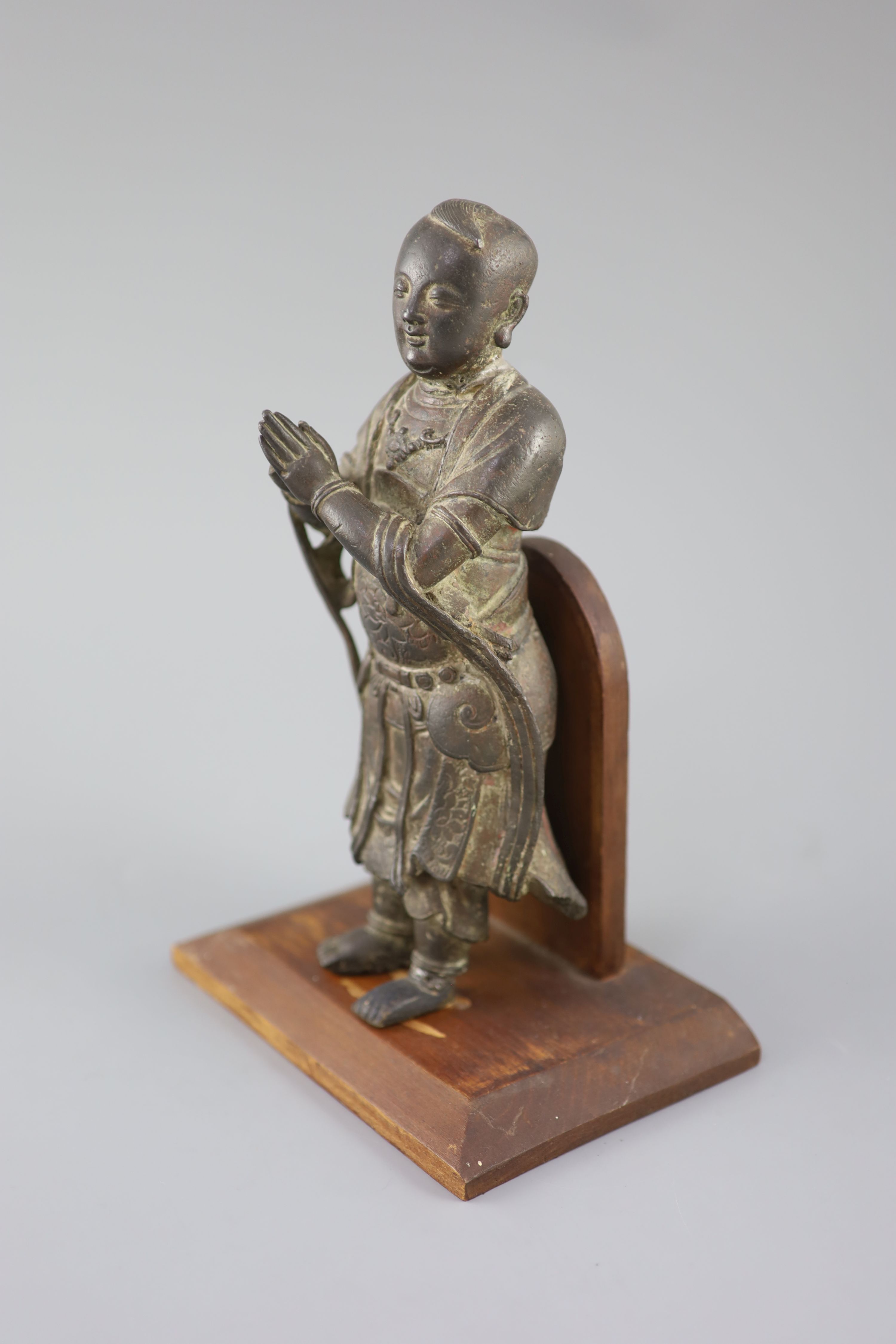 A Chinese bronze figure of Shancai Tongzi, late Ming dynasty, 25.5cm high, repairs, Provenance - A. T. Arber-Cooke